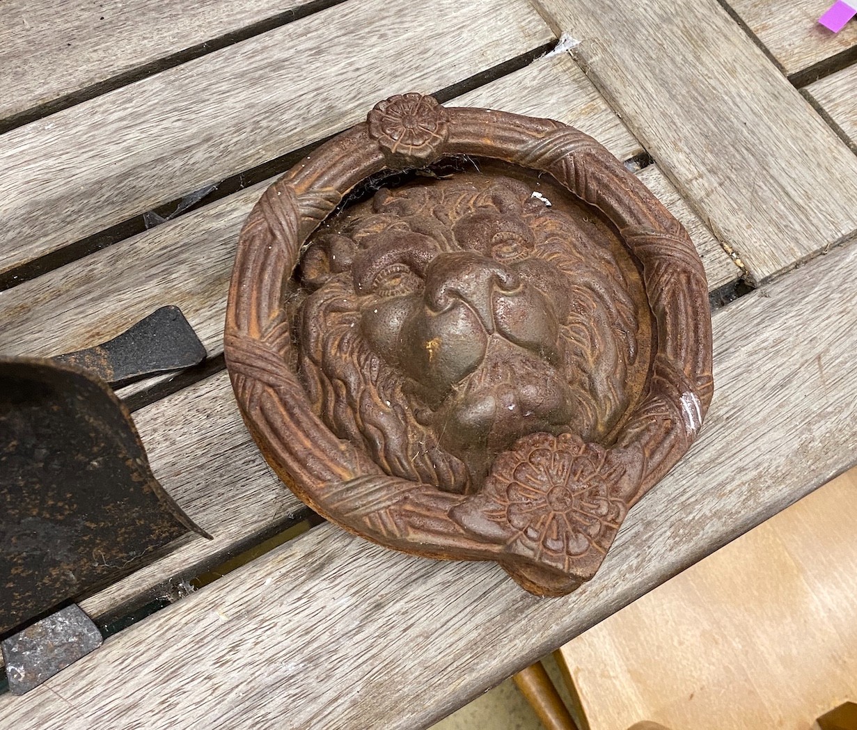 A fire companion set, a cast iron lion's mask door knocker and a group of metal keys